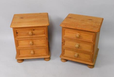 A pair of pine bedside chests