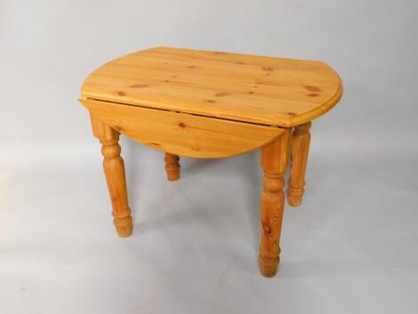 A pine drop leaf kitchen table