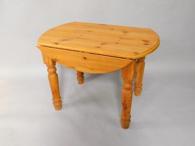 A pine drop leaf kitchen table