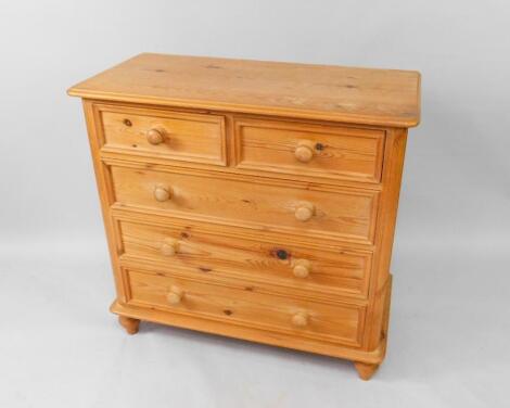 A pine chest of drawers