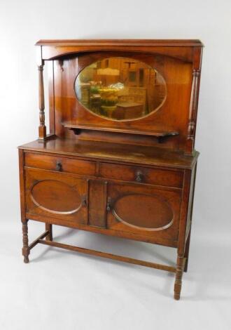 An early 20thC oak mirror back sideboard