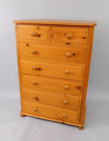 A pine chest of drawers