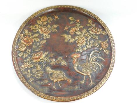 An Oriental early 20thC terracotta charger