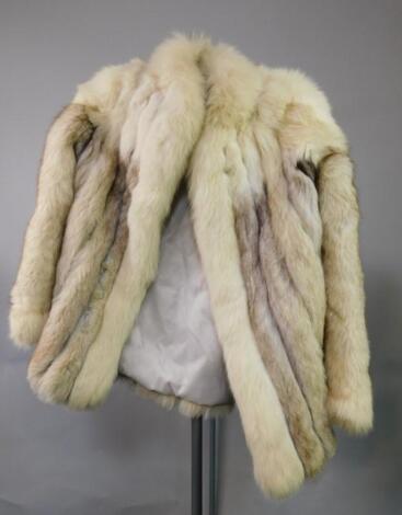 A Saga white fox fur jacket.