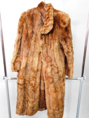 A lady's musquash fur coat.