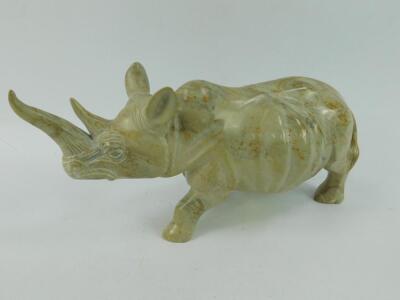 An African carved soapstone figure of a rhinoceros
