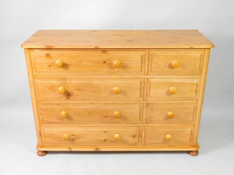 A pine chest of drawers