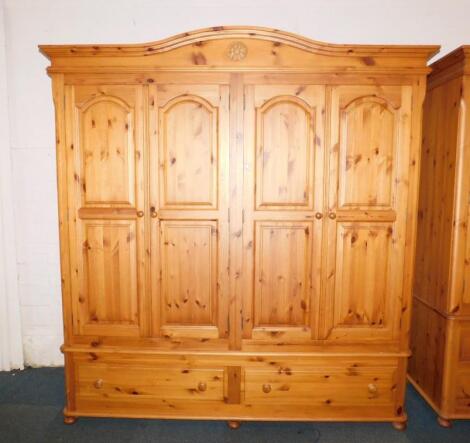 A pine four door wardrobe