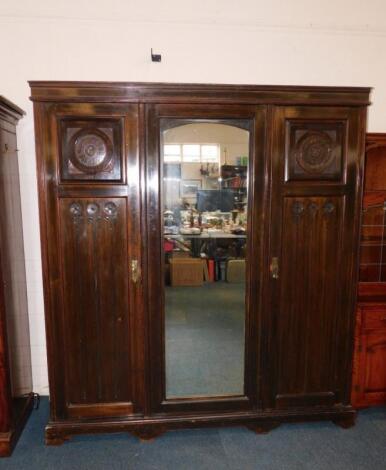 A Victorian oak Arts & Crafts compactum wardrobe