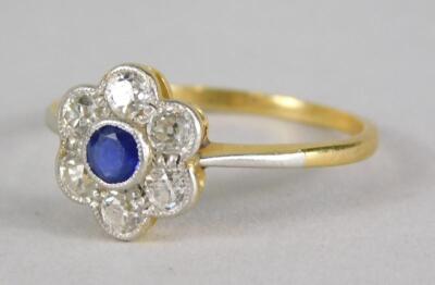 A sapphire and diamond floral cluster ring