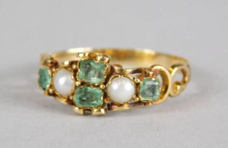 An emerald and seed pearl dress ring