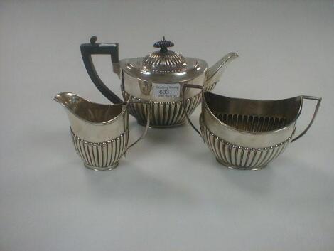 A Goldsmiths and Silversmith's Company three piece silver tea set of oval