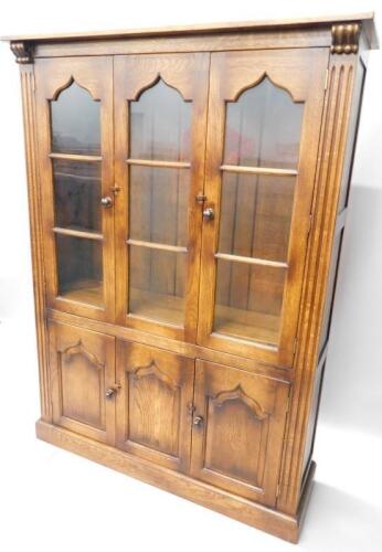 A distressed oak display cabinet