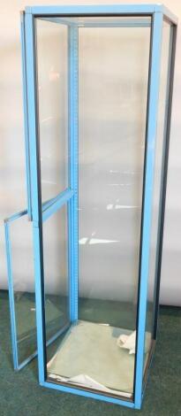 A blue painted shop display cabinet