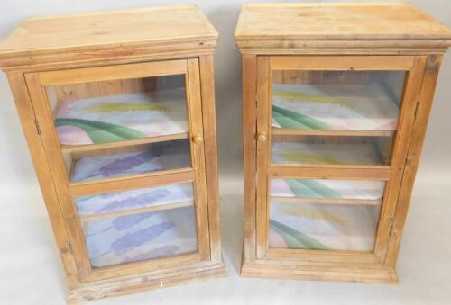 A pair of reclaimed pine glazed cabinets