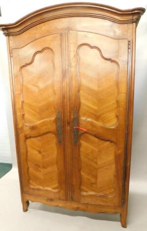 A 19thC French fruitwood armoire