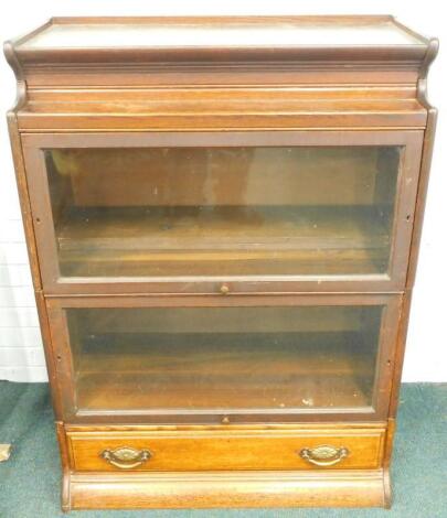 An early 20thC oak Globe Wernicke style two section bookcase