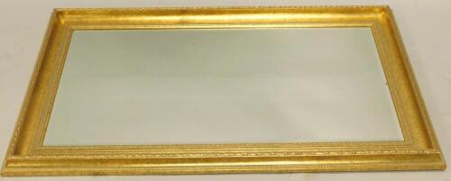 A gilt rectangular wall mirror