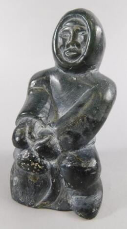 An Inuit carved stone figure of an Eskimo