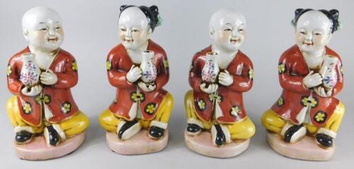 A set of four late oriental porcelain figures