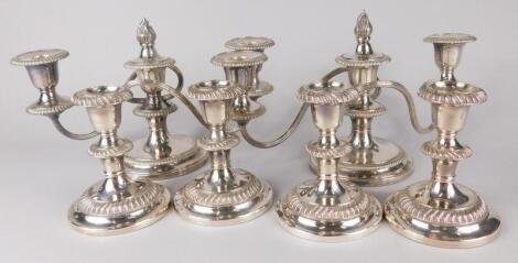 A set of four silver plated candlesticks