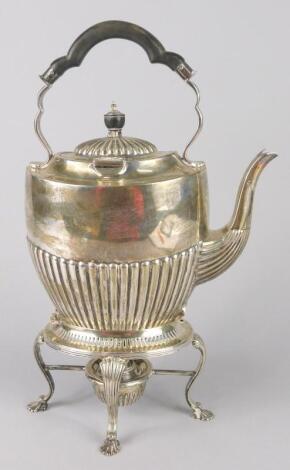 An oval silver spirit kettle and stand