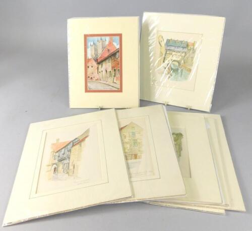 A group of unframed prints