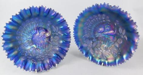 A pair of purple tinted Carnival glass bowls