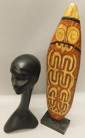 A retro style black painted terracotta mannequin head