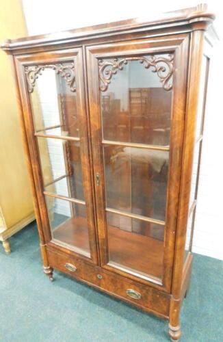 A Continental figured mahogany display cabinet