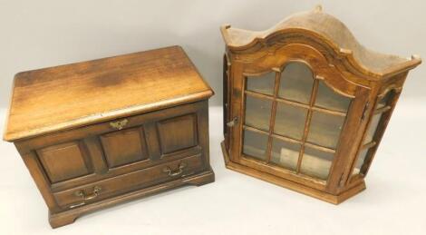 A small oak cupboard in the manner of Coffer Bach