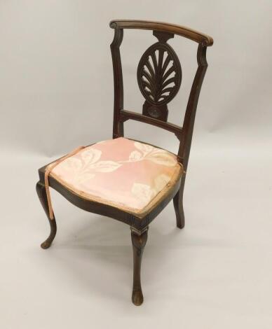 An Edwardian mahogany nursing type chair