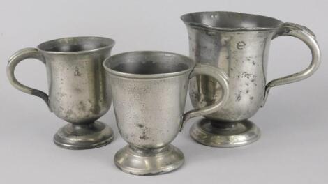 Three similar pewter cups