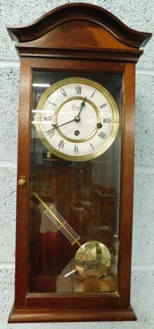 A Comitti of London mahogany cased wall clock