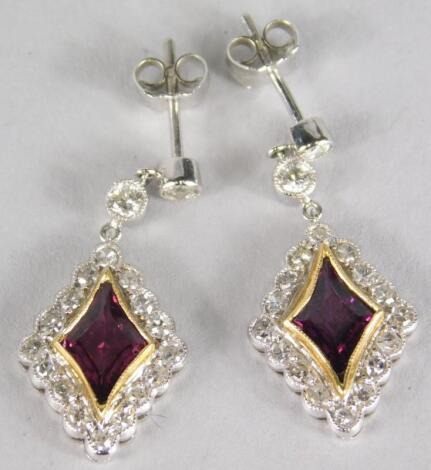 A pair of ruby and diamond earrings