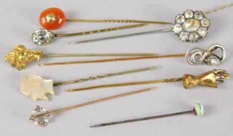 A collection of nine stick pins