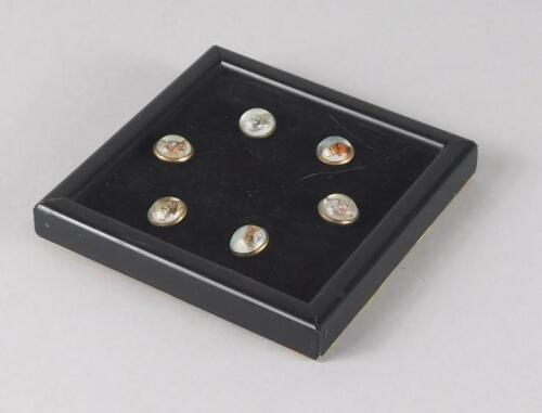 A set of six animal collar studs