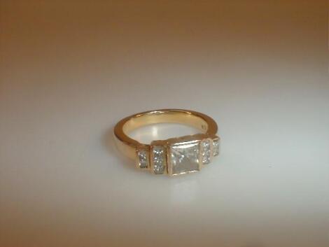 A modern multi stone set diamond ring