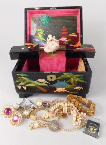 A Japanese black lacquer jewellery box and contents