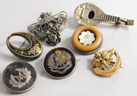 A collection of brooches