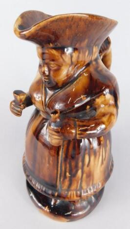 A 19thC treacle glazed gin woman Toby jug