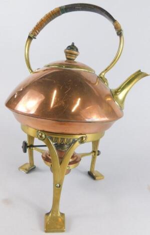 An early 20thC Arts & Crafts brass and copper spirit kettle