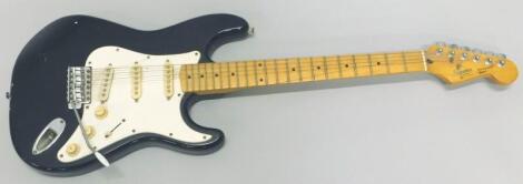 *A Korean Squier Stratocaster fender electric guitar