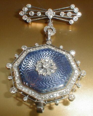 A ladies diamond set and enamel fob watch