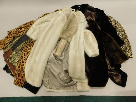 A collection of fake fur coats etc.