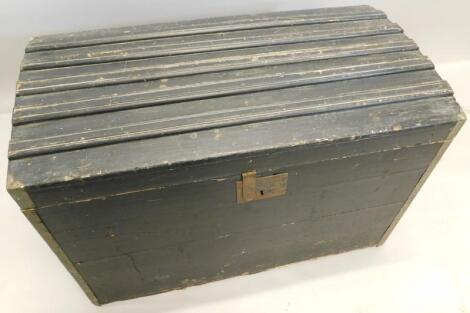 An early 20thC ebonised and brass mounted dome top trunk