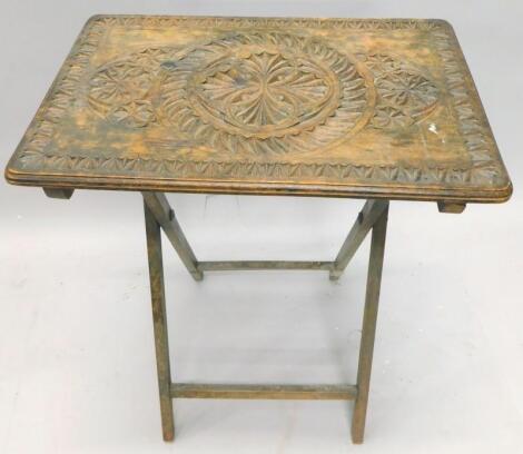 A late 19th/early 20thC chip carved folding table