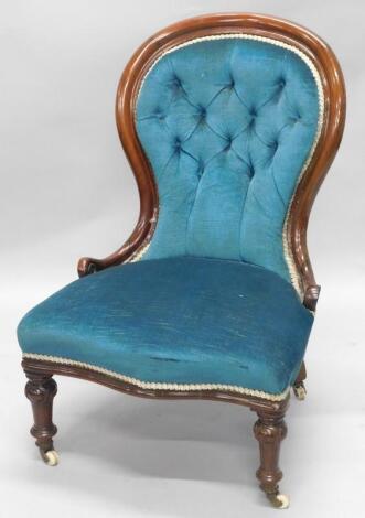 A Victorian mahogany spoon back nursing chair