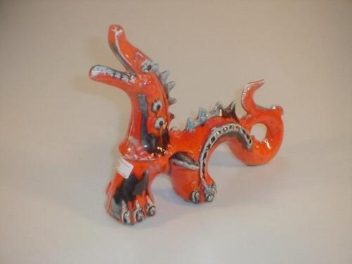 A stylised pottery figure of a dragon