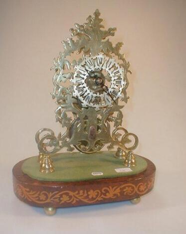 A Victorian style gilt metal skeleton clock with a pierced dial